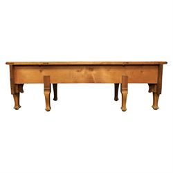 Art Nouveau oak hall mirror, the scrolling frame with large central bevelled mirror plate, boardered by six small mirrors with four shelves between, the base, with carved and pierced floral decoration, upon six cabriole legs   