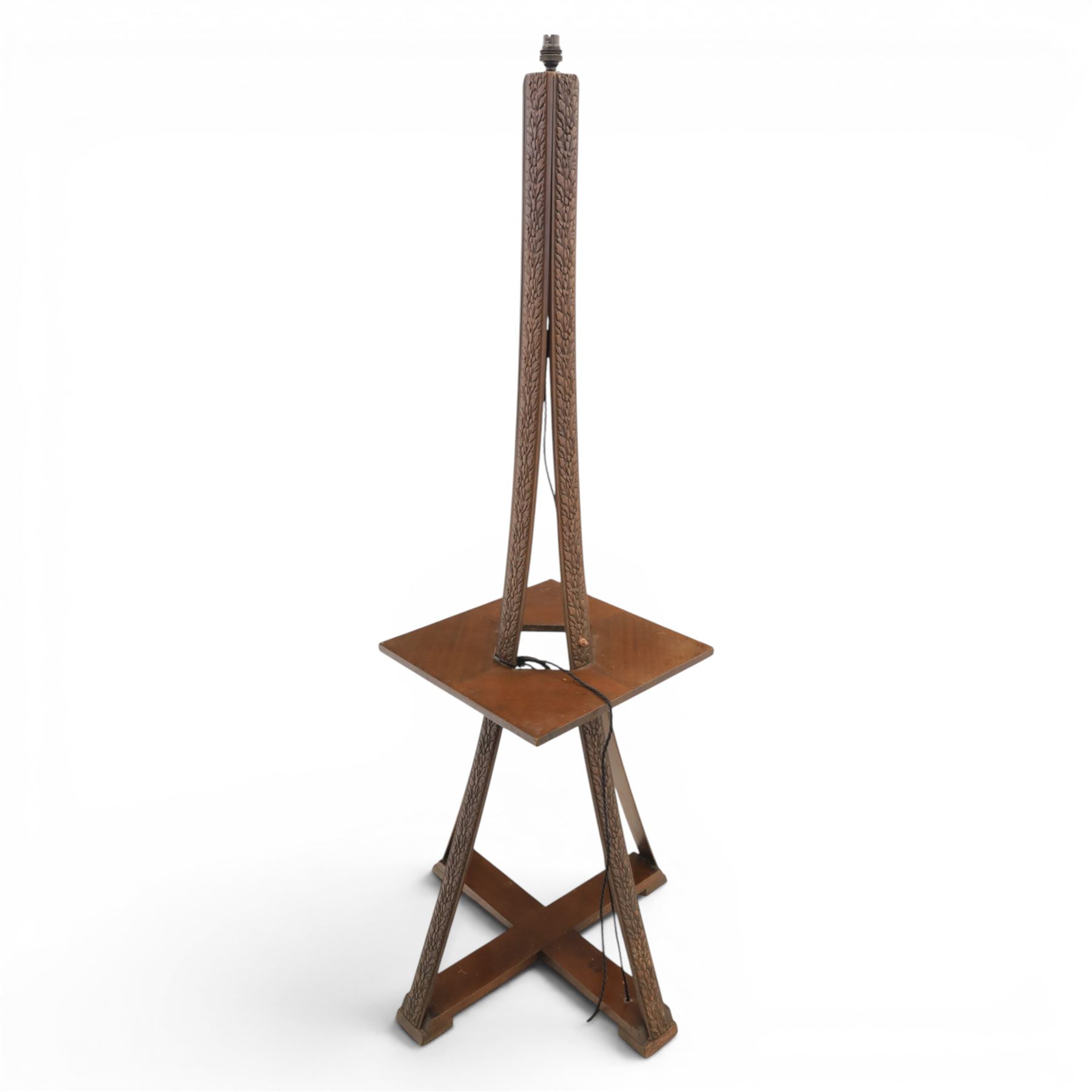 20th century stained wooden standing lamp, four foliate carved splayed supports, with square table platform, united by cruciform stretcher base, H158cm