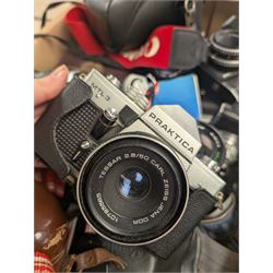 Collection of cameras, including Canon EOS 650, Praktica BMS, Inovar, Praktica MTL3, Zeiss Ikon Contina, etc