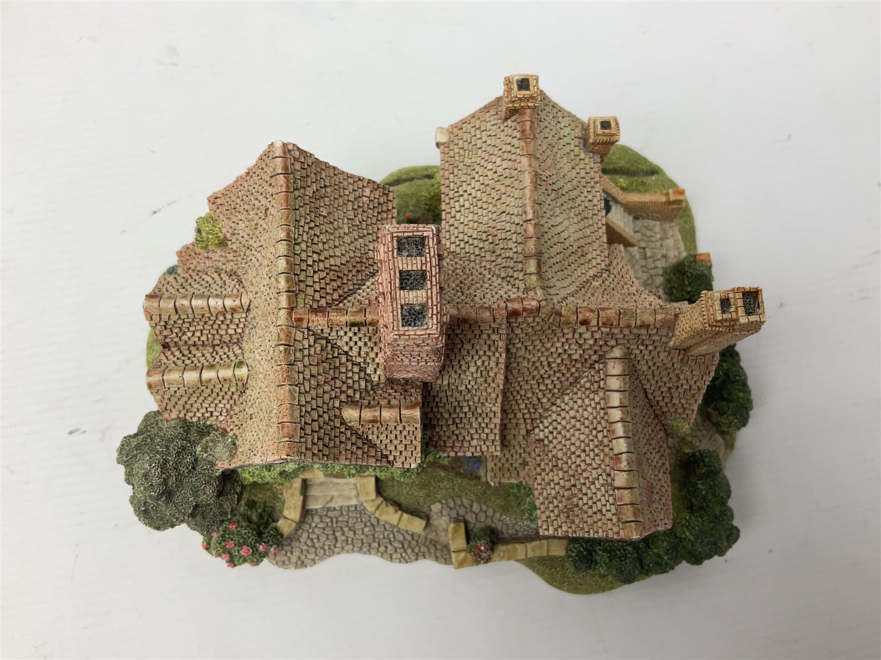 Three Lilliput lanes, comprising Oakwood Smithy, Anne of Cleves and Bluebell Farm, all with deeds and original boxes 