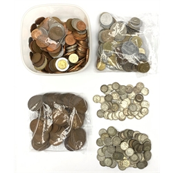 Approximately 90 grams of pre 1920 and approximately 140 grams of pre 1947 Great British silver threepence coins, two Queen Elizabeth II five pound coins, pre-decimal pennies etc