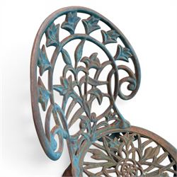 Cast iron garden table and four chairs, in the Art Nouveau style, with pierced floral and foliate decoration throughout, circular table raised on four cabriole legs with stretcher ring, chairs with shaped openwork backs and seats, in a weathered green finish