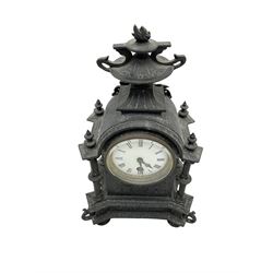 French - 19th century 8-day timepiece mantle clock in a cast iron effect case, break arch case surmounted with a flaming urn, free standing pillars to the corners and raised on four circular feet, enamel dial with Roman numerals, minute track, fleur di Lis hands, and egg and dart slip. With pendulum.