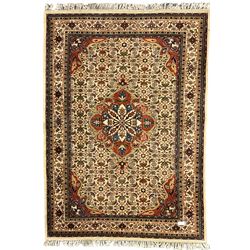 Indo-Persian Baktmar rug, decorated with central floral medallion surrounded by Herati motifs, the main border with repeating pattern decorated with stylised plant motifs, within guard stripes 