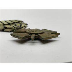 Four French medals - St. Helena medal with bust of Napoleon to obverse and inscription to reverse 'Campagnes de 1792 a 1815. A ses compagnons de gloire sa derniere pensée Ste. Hélène 5 Mai 1821', established by Emperor Napoleon III in 1857; two WW2 Croix-de-Guerre; and WW2 Croix-du-Combattant; all with ribbons (4)