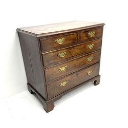 Georgian oak chest, fitted with two short and three long graduating drawers, raised on shaped bracket supports 