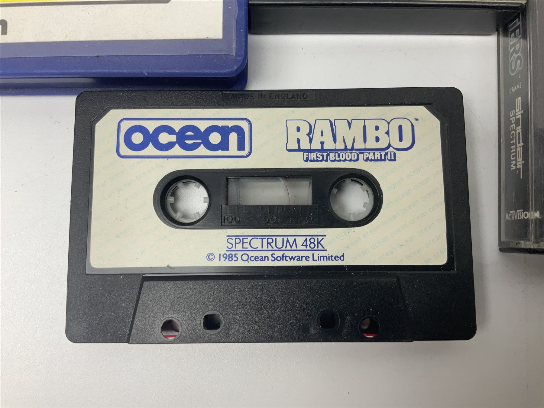 Sinclair ZX Spectrum (1984) with accessories and games; ten games for Sinclair Spectrum and 48K Spectrum to include ‘Knight Lore’, ‘The Way of the Exploding Fist’, and ‘Green Beret’ all in original boxes, ‘Rambo First Blood Part II’ without original box; Sinclair UK1400 Power Supply Unit, Hales Universal Mains Adapter, RAM Turbo Spectrum Joystick Interface, Starlite Cassette Player, all without boxes