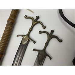 Near pair of short swords each with slightly curving 41cm fullered steel blade and all brass H-shaped hilt L52cm overall; plaited black leather whip; and reproduction pair of brass hilted swords, brass halberd blade and mace (7)