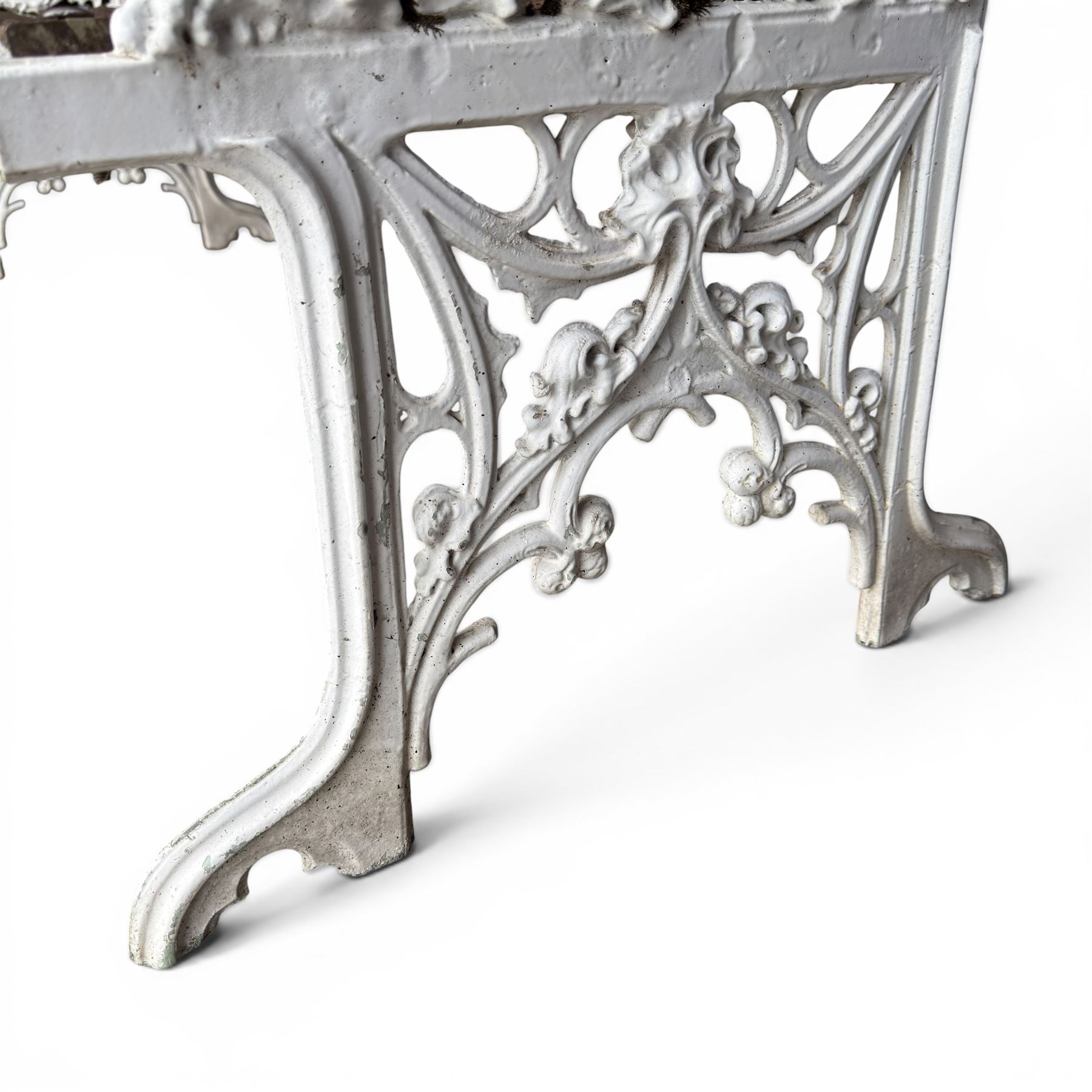 Coalbrookdale Gothic design cast iron and slatted teak garden bench, the ornate pierced back and sides of arched design, with central cartouche shield surrounded by stylised crosses and trefoils with interspersed flowerheads, the scrolled arm terminals with stylised griffon motifs and trailing fruiting vines 