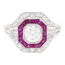 Platinum diamond and ruby cluster ring, the principal transitional cut diamond of approx 0...