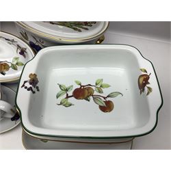 Royal Worcester Evesham pattern, including covered pot de cremes, twin handle tureen, serving dishes, flan dishes, side plates etc  