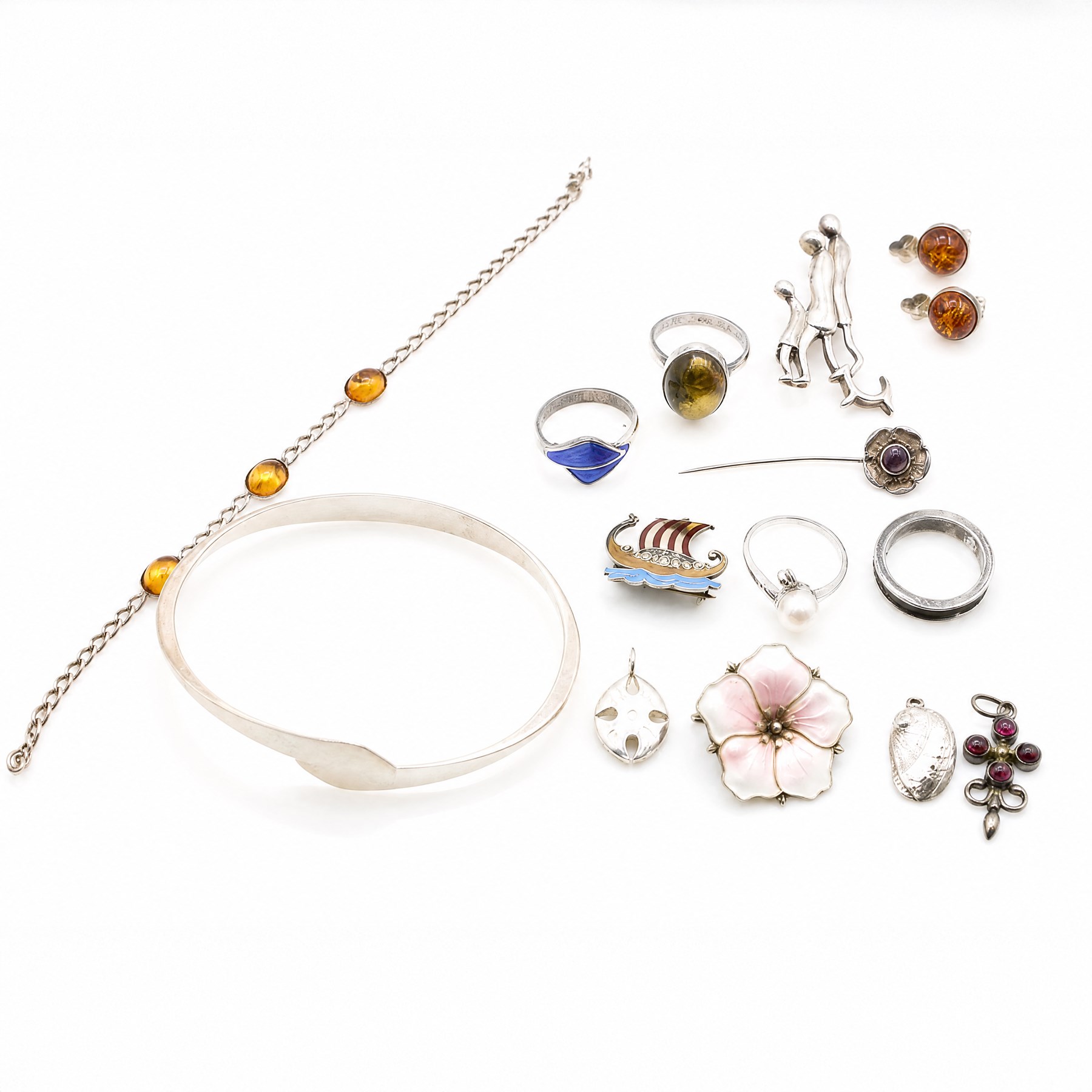 Silver jewellery including silver-gilt and guilloche enamel flower brooch by Askel Holmsen, amethyst ring, possibly by Nina Breddal, enamel Viking ship brooch by Andresen & Scheinpflug, torque bangle, amber earrings, necklace and ring, etc  