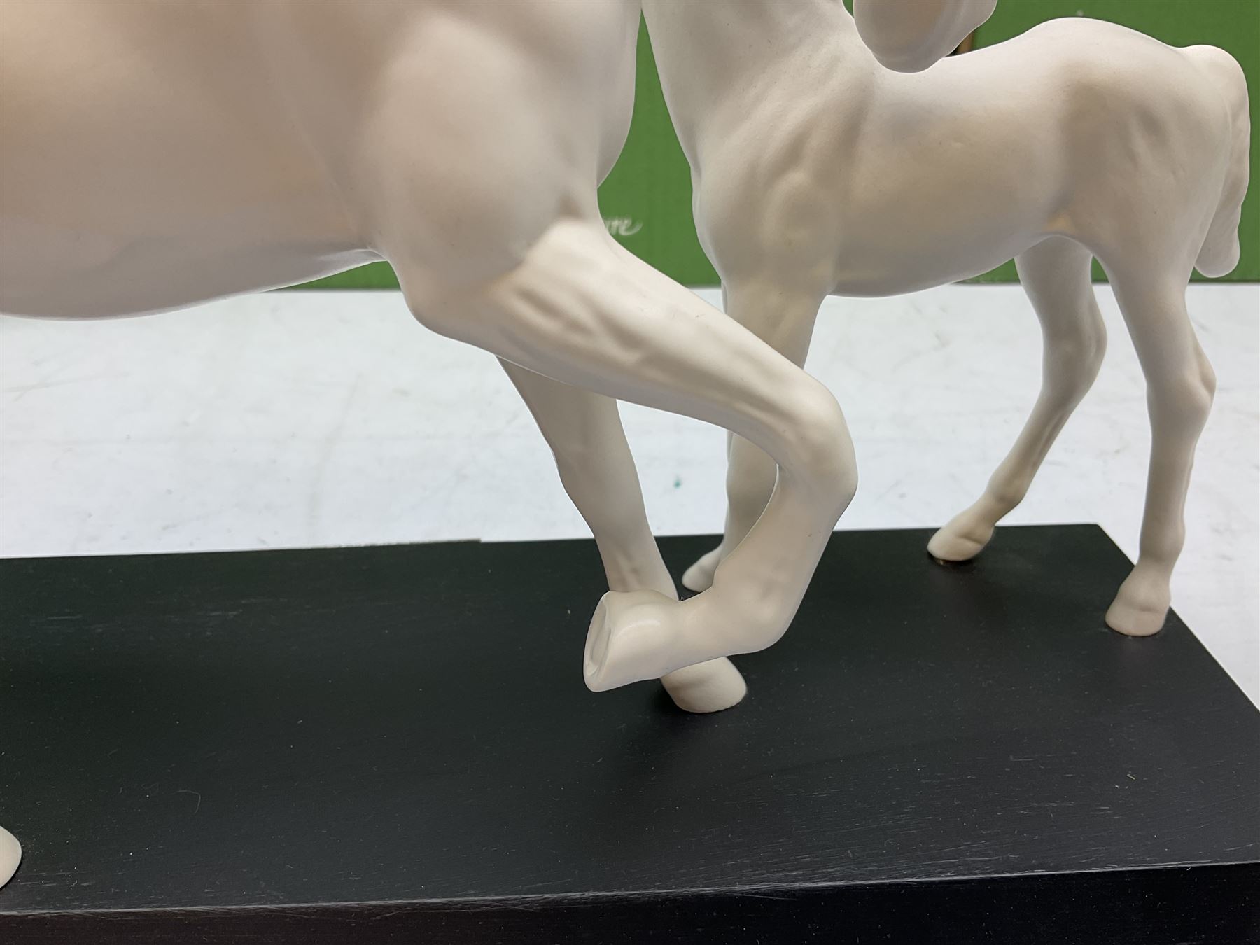 Five Beswick and Royal Doulton horse figures in matt white on black plinths, comprising of  Spirit of Affection no. 2689/2536, Springtime no.2837, Spirit of peace no.2916, Spirit of earth no.2914 and Spirit of the wild no. 183, together with a composite figure of a horse (6)