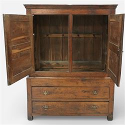 Georgian rustic oak housekeeper’s cupboard, moulded cornice above a pair of fielded panel cupboard doors enclosing a boarded interior with central divider and hanging hooks, the base fitted with two long drawers with brass swan neck handles, raised on stile supports