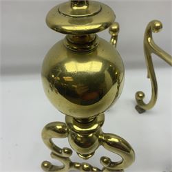 Pair of early 20th century brass fire dogs, each with sphere and urn finial, upon a scrolling base, H38cm