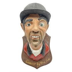 Composite figure of the head of a huntsm