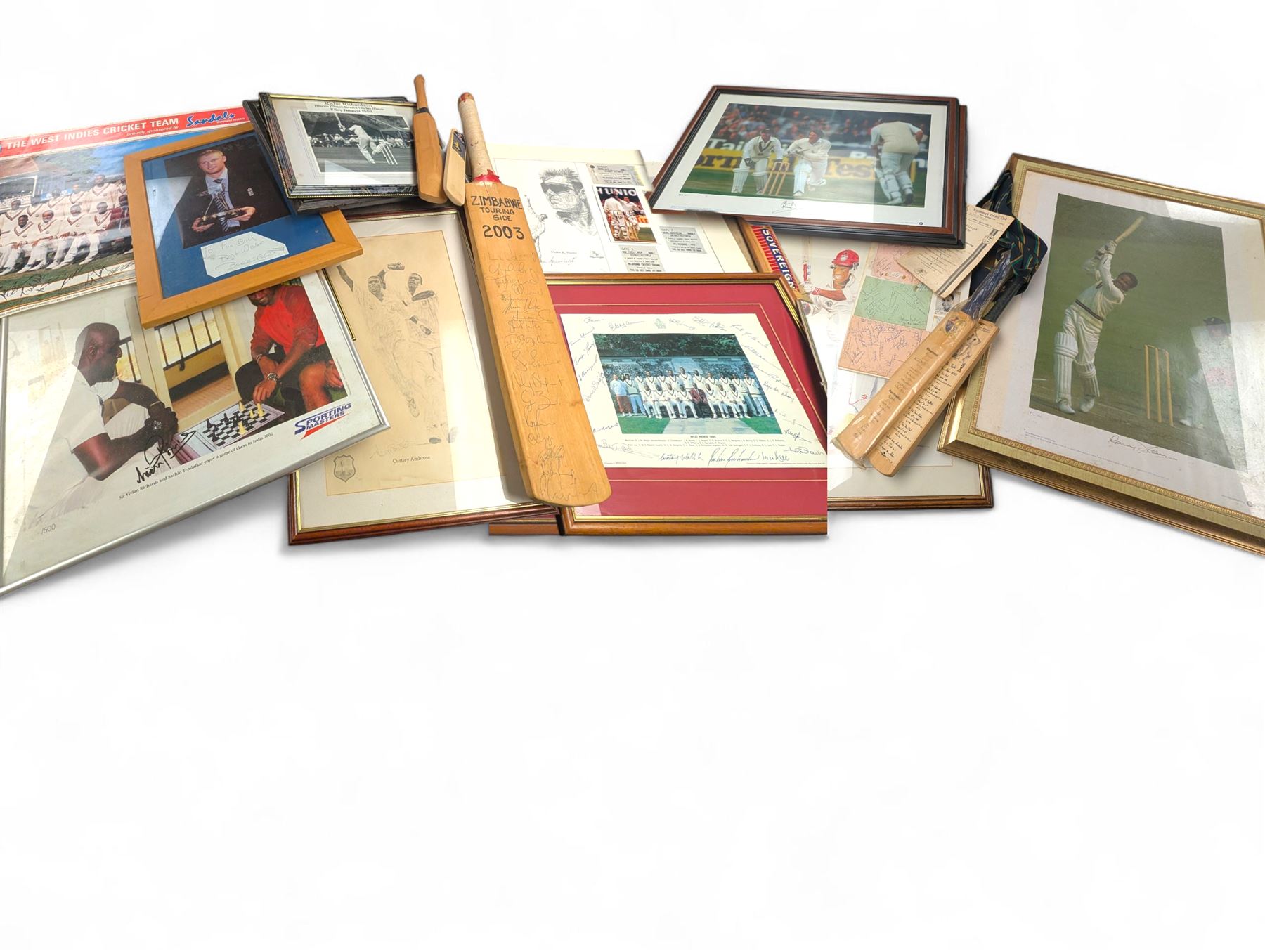 Collection of signed International cricket memorabilia, mostly relating to West Indies, including Curtly Ambrose and Brian Lara prints, Shane Warne and Glen McGrath last test souvenirs, signed Zimbabwe 2003 tour cricket bat, etc