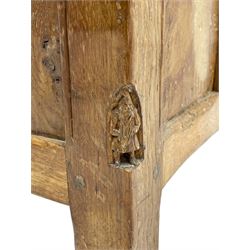 Gnomeman - oak blanket box, all-over adzing, the hinged top over figured and burr panelled front, decorated with carved crenellations and arcade, carved with gnome signature, pierced handles to each end forming the central rail, wrought metal hinges, on stile supports, by Tom Whittaker, Littlebeck, Whitby