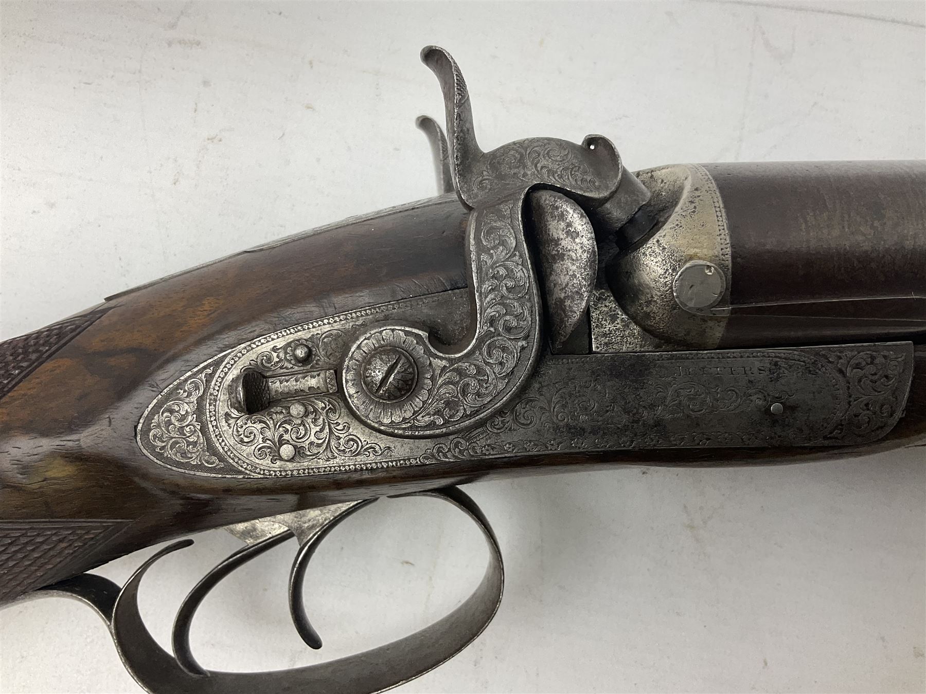 19th century John Jefferson of Scarborough 6-bore (modern 4-bore) double barrel side-by-side percussion gun, with 81cm stub twist damascus barrels (no provision for ramrod), well figured walnut stock with fine chequered grip and fore-end with horn tip and steel butt plate with long tang, well engraved lock and hammers with half-cock safeties on both sides, barrel sling swivel but rear sling swivel removed and replaced with silver escutcheon, London proofmarks, NVN, L128cm