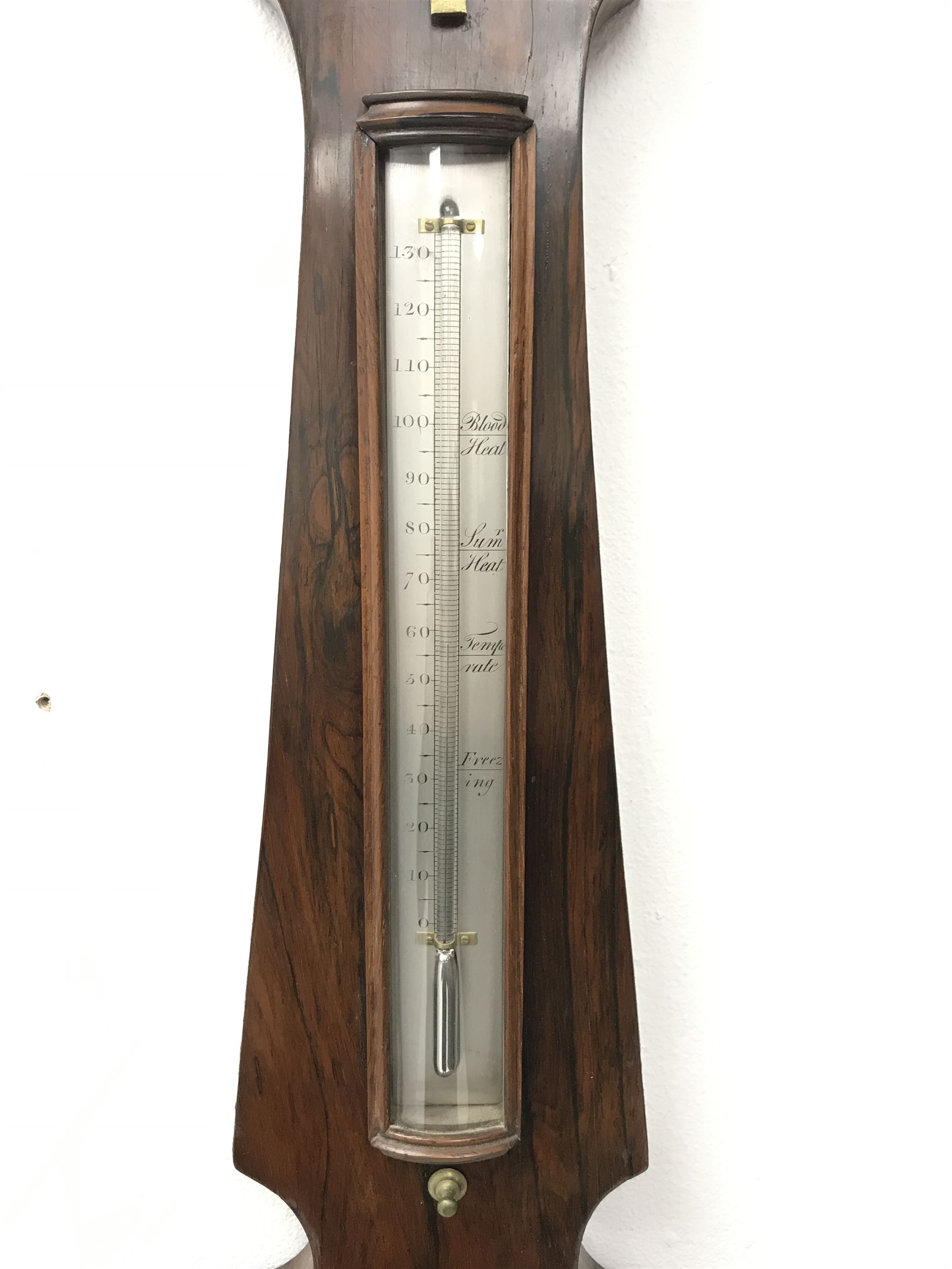 Early 19th century rosewood four dial banjo barometer, dry/damp dial, mercury thermometer, silvered circular register engraved with urn and scroll decoration, balance signed 'Vassalli Scarborough', fitted with mother of pearl adjusting handle