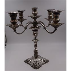 Modern silver five branch candelabra centrepiece, the four extending branches each with removable sconces, surrounding a central candle holder, upon a knopped stem and weighted stepped square foot, with anthemion to each corner, hallmarked Roberts & Belk, Sheffield 1984, H36cm 