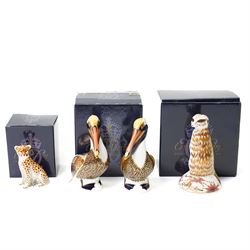 Four Royal Crown Derby paperweights, comprising Meerkat with gold stopper, two Brown Pelic...