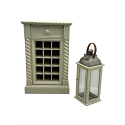 Contemporary painted wooden wine cabinet, rectangular form with carved leaf moulded cornice over single drawer and fifteen bottle compartments, flanked by spiral twist pilasters; together with a cream painted and chrome lantern, with glazed sides and leather handle (2)