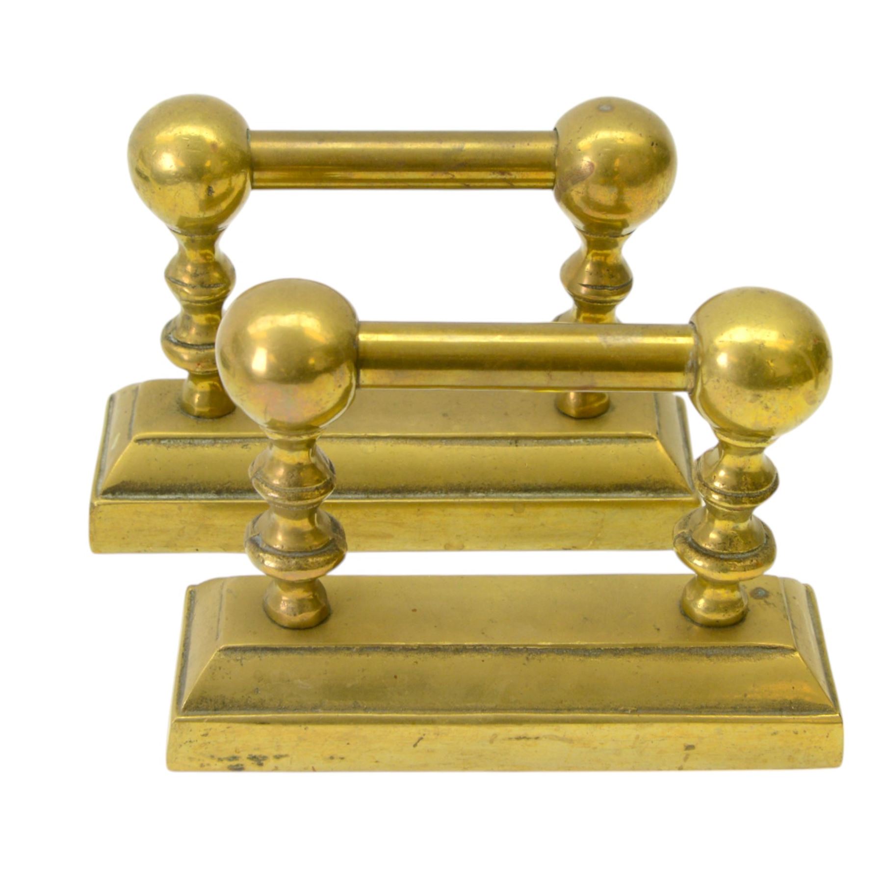 Pair of  Victorian brass fire dogs, decorative brass ball roundels to tops, with a silvered cartouche to the front, raised upon paw feet, together with two other fire dogs, largest H36cm 