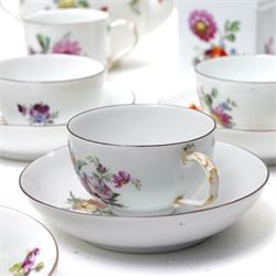 18th century Berlin part tea and coffee service circa 1780 painted with sprays of Spring flowers comprising four tea cups, five coffee cups,  six saucers, tea pot, tea caddy and sucrier and cover  