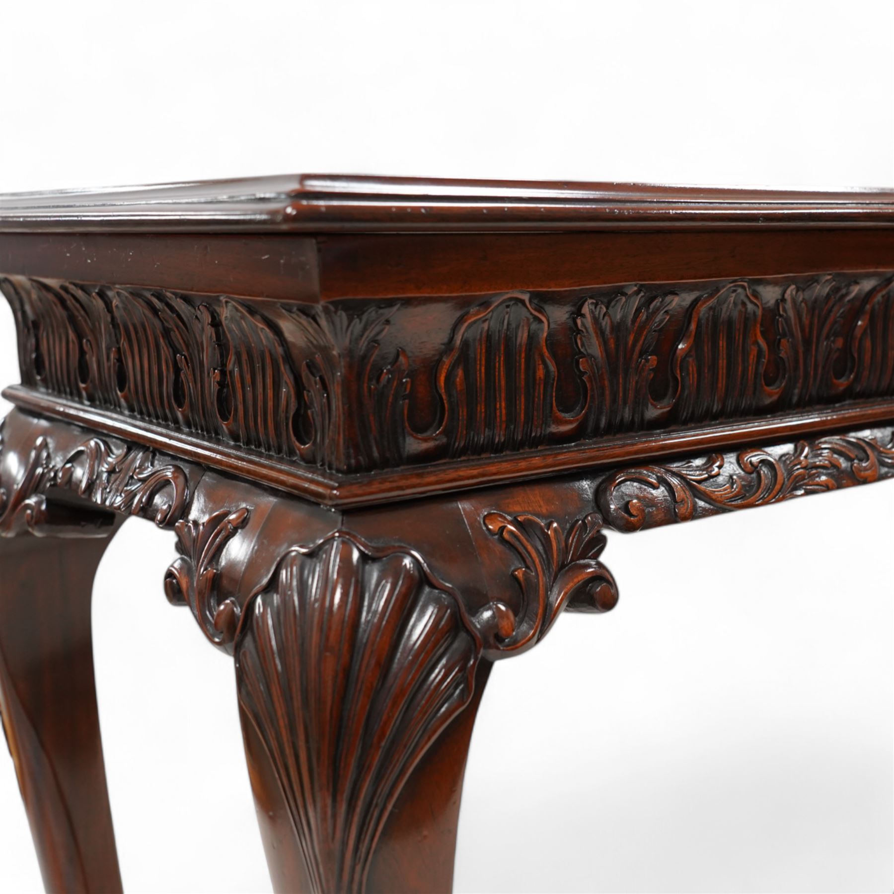 Georgian design mahogany console or side table, moulded rectangular top over palmette carved frieze, decorated with scrolling leafage, shell and bell flower carved cabriole supports with ball and claw feet 
