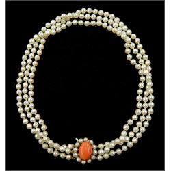 Three strand white/pink cultured pearl necklace, with 9ct gold coral and pearl clasp, London 1982