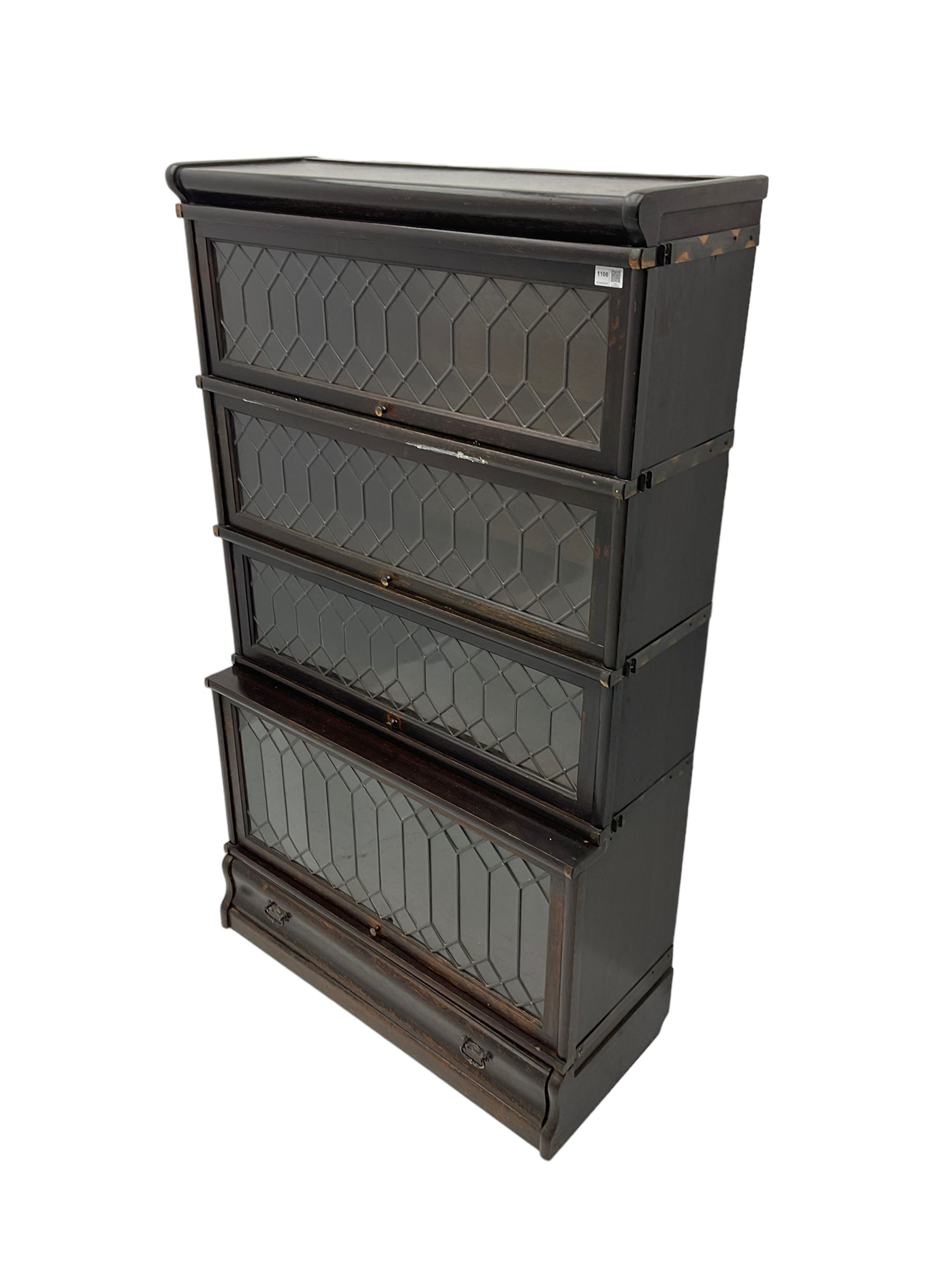 Globe Wernicke - early 20th century oak stacking library bookcase, enclosed by four lead glazed doors, fitted with single drawer