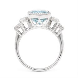 18ct white gold aquamarine and diamond stepped design ring, single milgrain set octagonal cut aquamarine of approx 7.00 carat, with seven round brilliant cut diamonds set either side, stamped 750, total diamond weight approx 0.40 carat