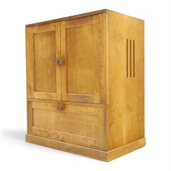 Lizardman - adzed oak media cabinet, adzed rectangular top above twin doors enclosing a shelved interior, above a fall front drawer, Yorkshire Rose carved handles, raised on castors, with carved lizard signature, by Derek Slater of Crayke  