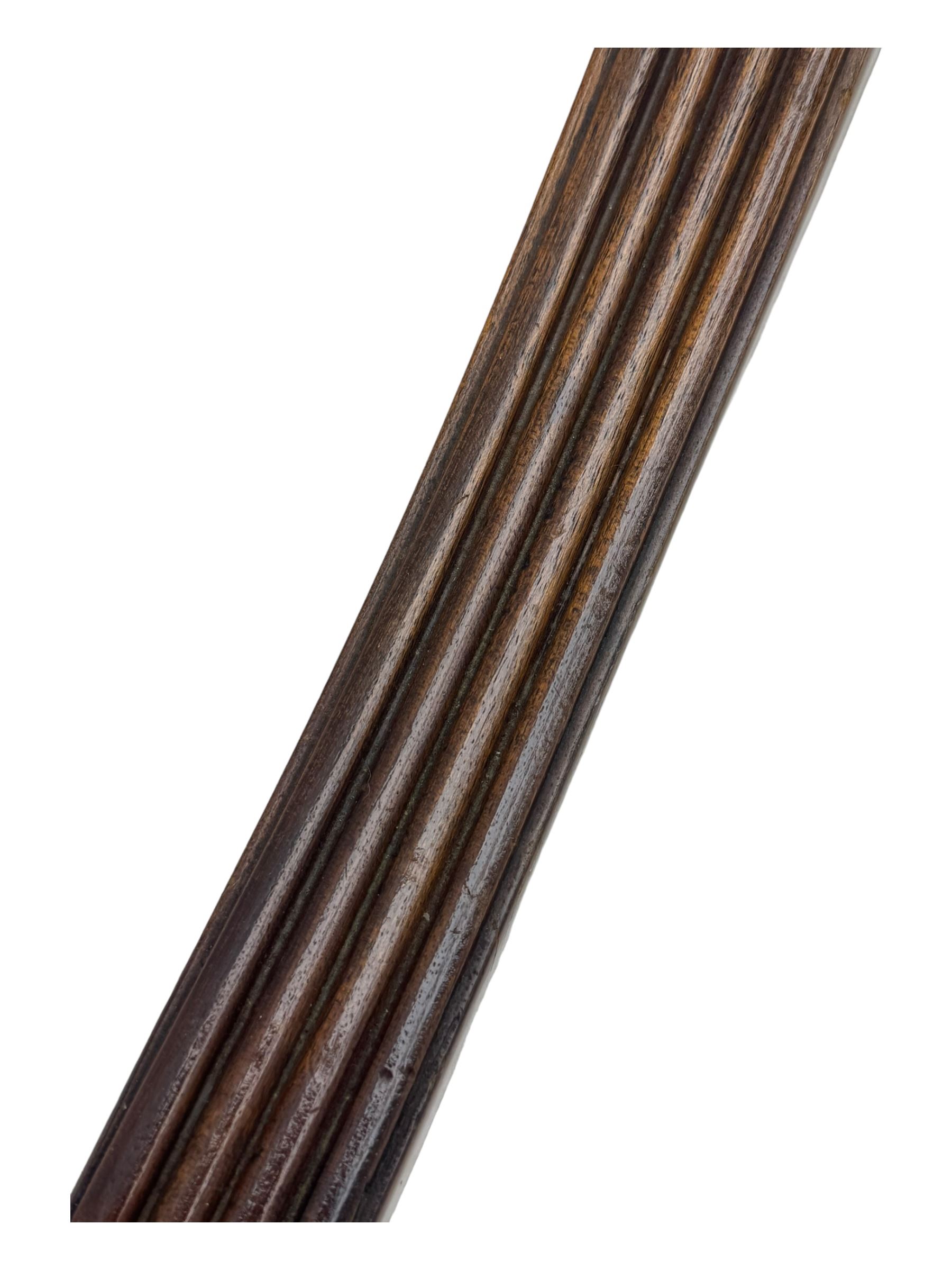 Early 20th century Regency design mahogany tilt-top table, circular top with edge banding, supported by a central turned pedestal with four reeded sabre supports terminating in castors; six chairs with pink upholstered drop in seats (7)