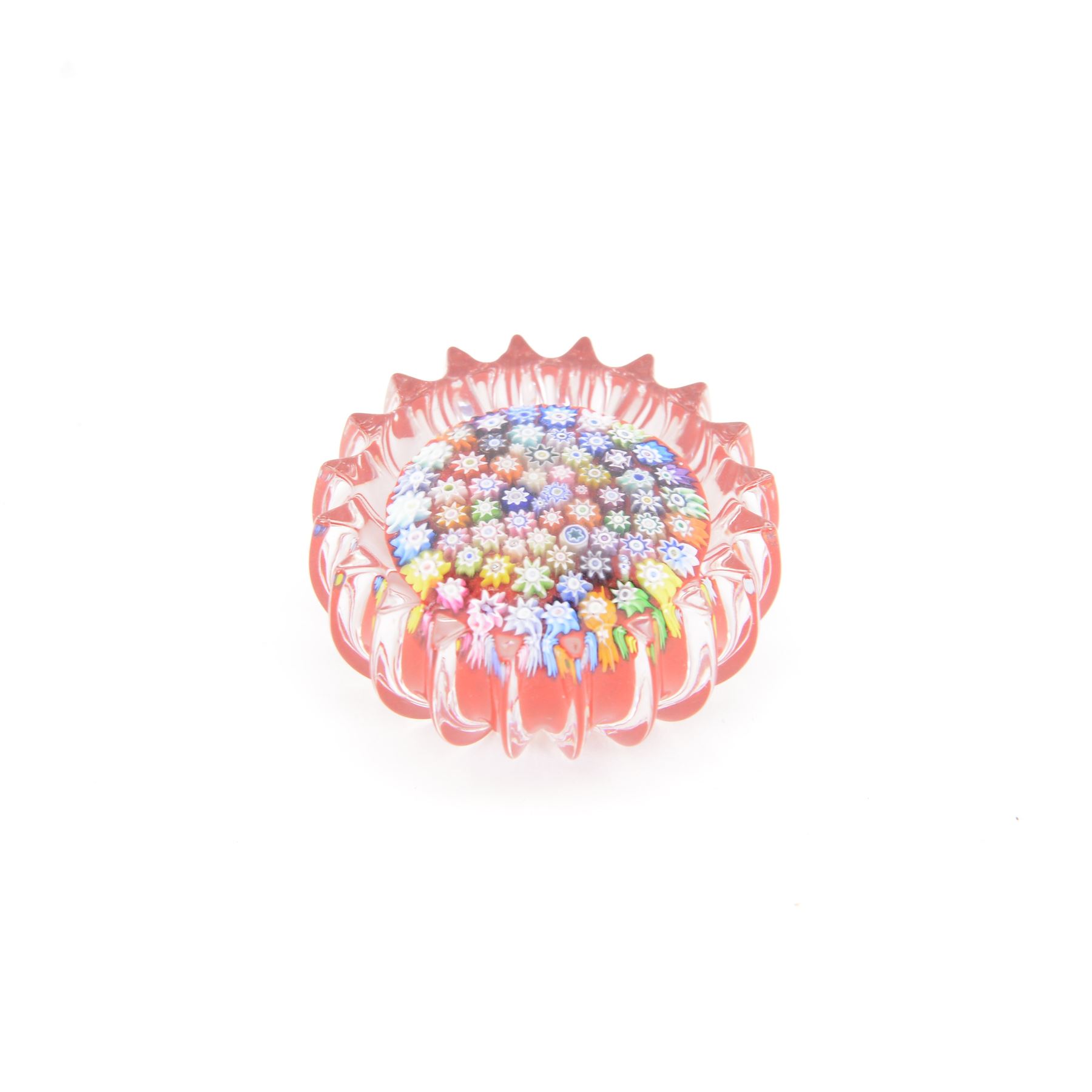 Two Peter Dougall glass paperweights, one of domed form, internally decorated with a  multicoloured millefiori canes, the other with fluted edge the with millefiori canes on a red ground, together with Whitfriars paperweight, all signed    