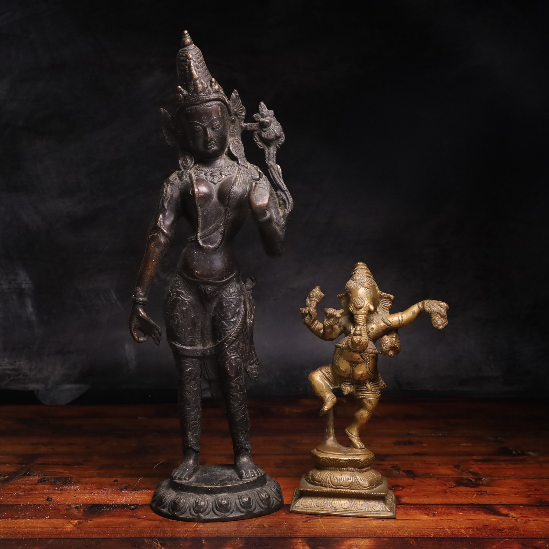 Brass sculpture of Ganesh,, together with a bronzed buddha stood upon a lotus leaf, largest H42cm 