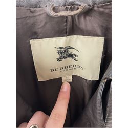 A ladies Burberry dark brown leather jacket, with waist belt and logo lining, size medium 