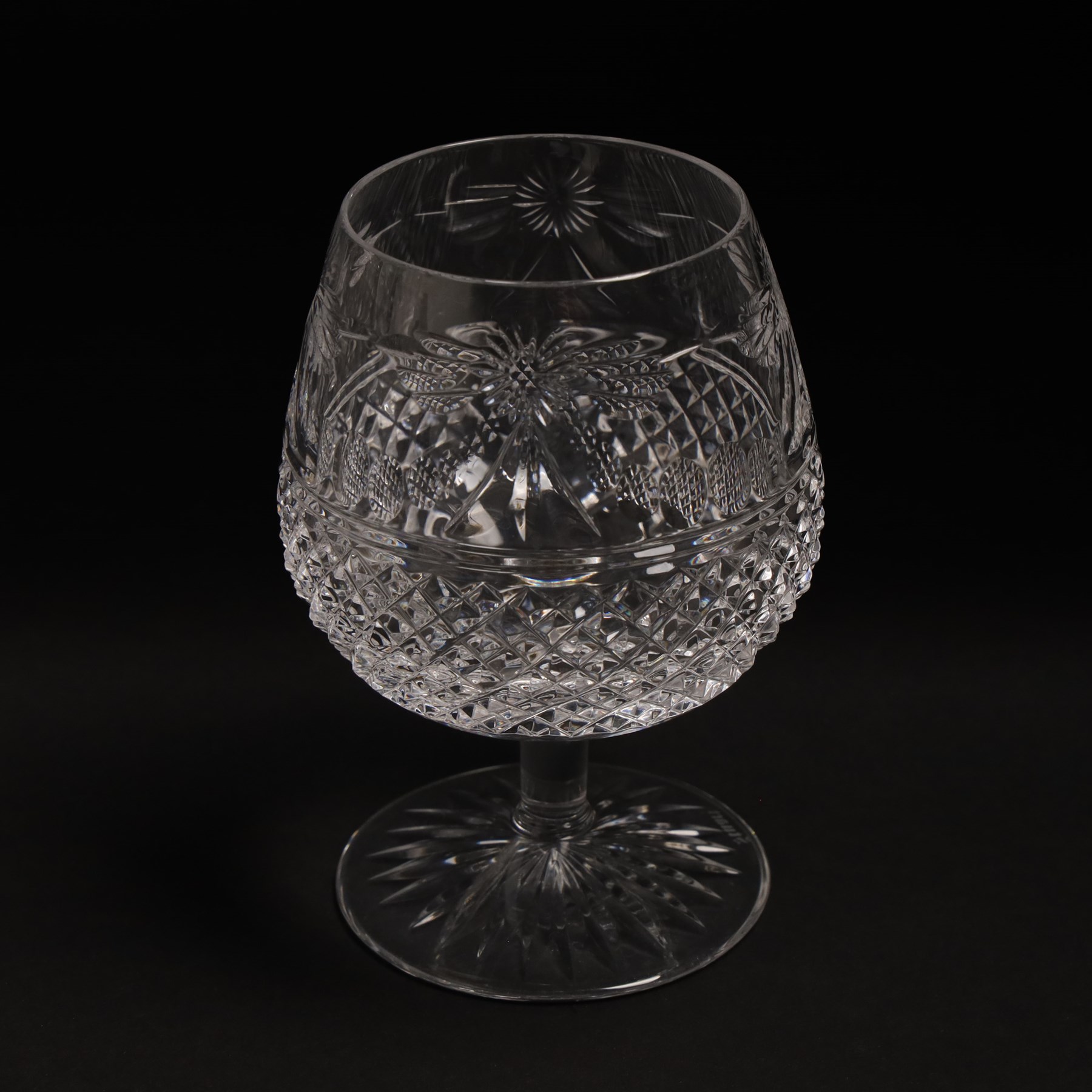  Suite of Stuart crystal Beaconsfield pattern table glass, comprising 6 claret glasses, 6 white wine glasses, 6 dessert wine glasses, 6 brandy balloons, 6 champagne flutes, and 9 whisky glasses