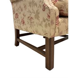 Peter Dudgeon - Georgian design mahogany framed armchair, shaped cresting rail over sprung back and seat flanked by rolled arms, upholstered in floral patterned fabric with matching seat cushion, on square supports joined by stretchers
Provenance: From the Estate of the late Dowager Lady St Oswald