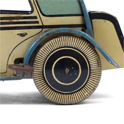 Wells tinplate clockwork limousine, the cream body, with blue roof and lithographed details, with driver and key, H8cm, L23cm