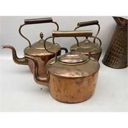 Quantity of copper to include six kettles, some examples with brass fixtures, Middle Eastern copper saucepan with lid, on three burner stand and copper jug in two boxes