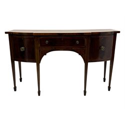 George III mahogany bow-fronted sideboard, serpentine-shaped top with crossbanded and boxwood stringing, over a central drawer flanked by deep cupboards, on square tapering supports terminating in spade feet