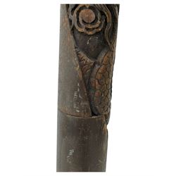 Early 20th century floor lamp, with fringed and pleated silk shade over a carved and turned column, on a circular stepped base