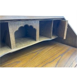 Old Charm oak bureau, fitted with fall front above four drawers