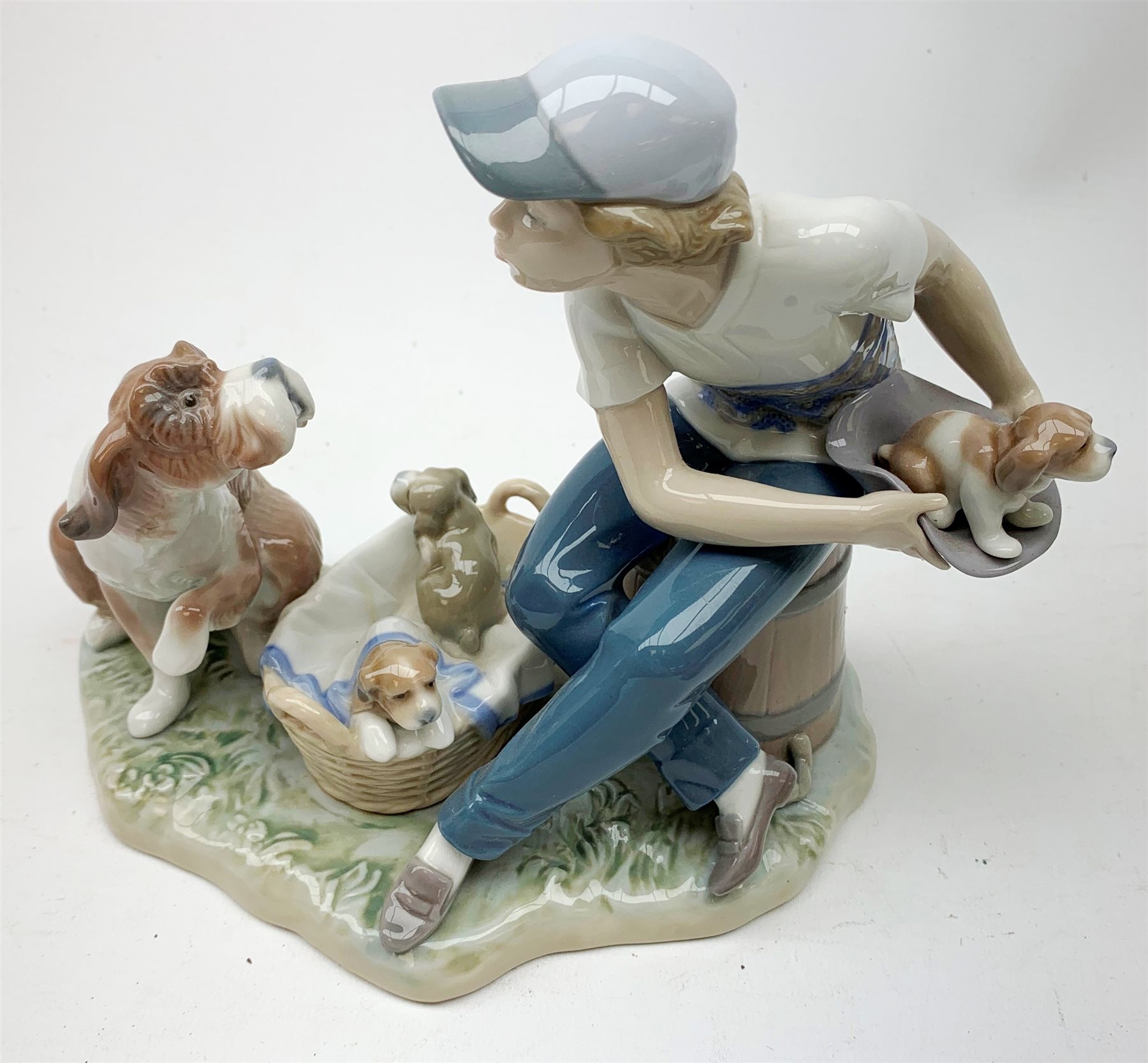 A Lladro figurine, 'This one's mine' Model 5376, H19cm, together with