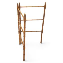 Victorian simulated bamboo two section towel rail, with turned brass capped finials, with three rails for hanging, hinged at one side