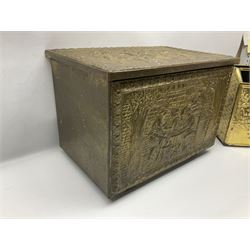 Pair of brass and iron fire dogs, together with brass coal box embossed to the lid with figures and a brass magazine rack, coal box H32cm