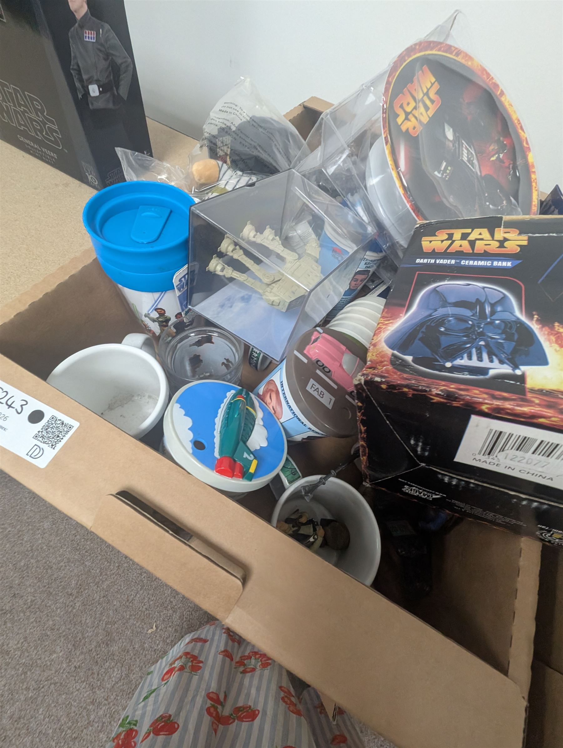 Star Wars collectables, including calendars, plate, plastic cups, Darth Vader money bank, VHS tapes, Masterworks lithograph collection, etc together with some Thunderbirds cups, Texas Chainsaw Massacre plush, etc