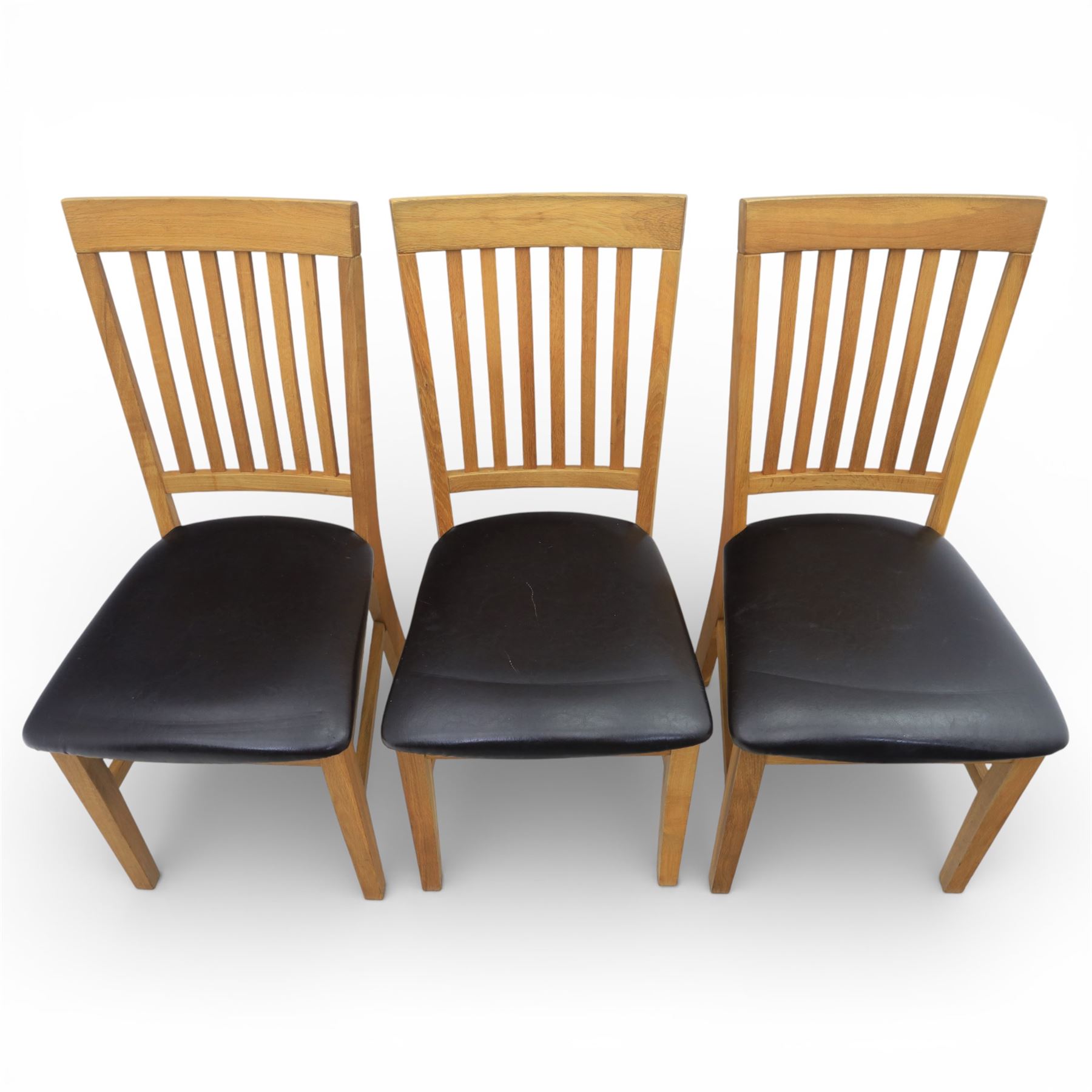 Solid light oak extending dining table with single leaf, and set of six chairs